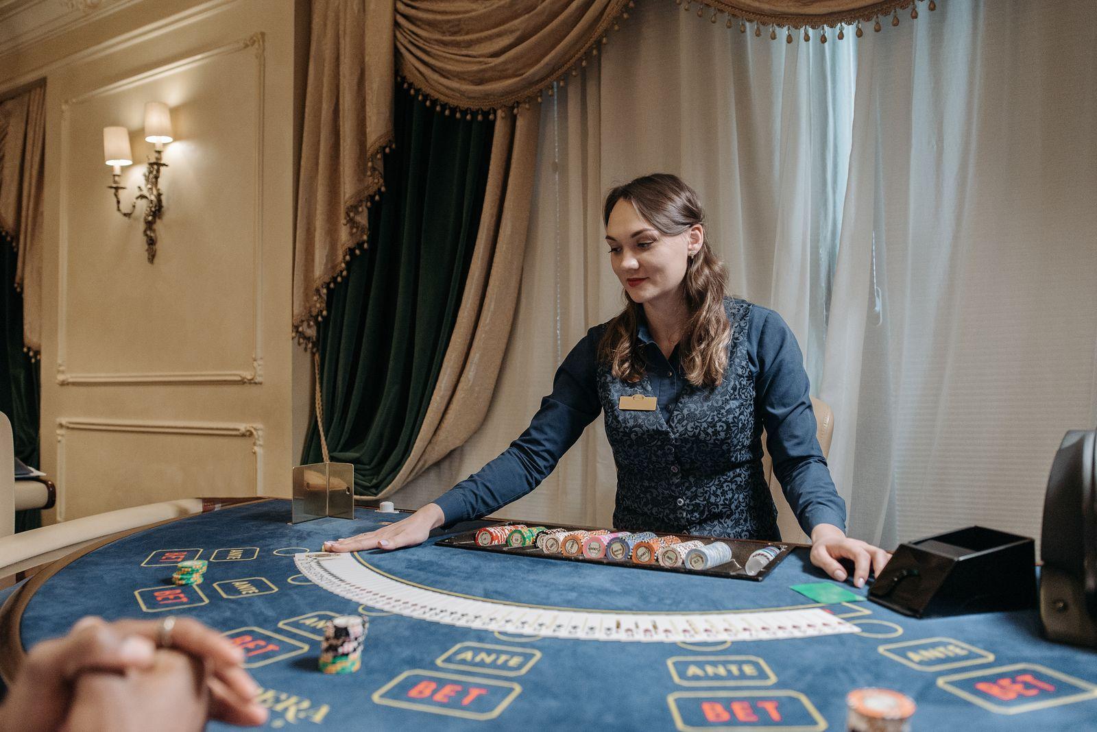 Cards on a felt table for a blackjack basic strategy example